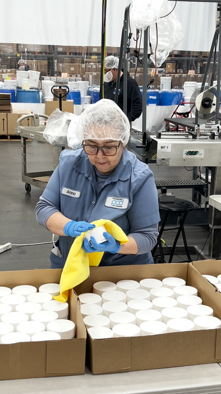 The #003 production floor in the USA: freshly filled jars being inspected and labeled